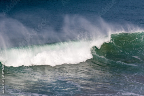 Beautiful Blue powerful ocean wave with splashes. Waves background. Hight tide