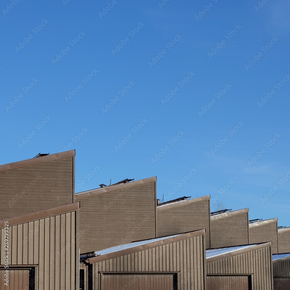 Close up of home's roof with blue sky Close up of home's roof with blue sky