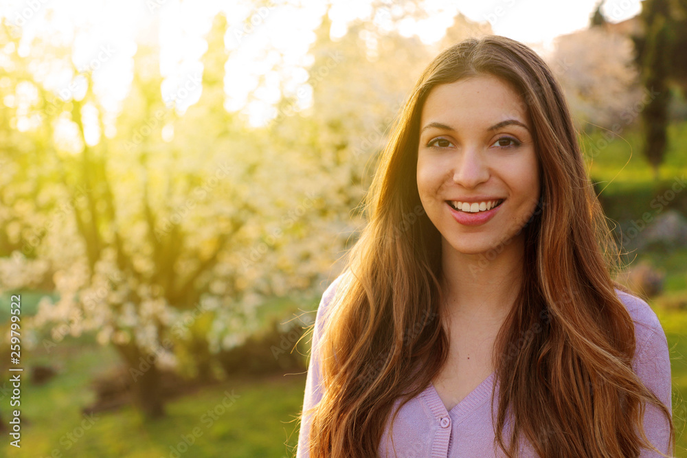 Portrait of beautiful woman with blooming trees in spring Portrait of beautiful woman with blooming trees in spring