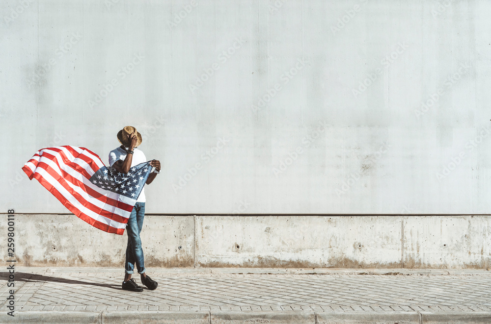Happy black man with flying American flag Happy black man with flying American flag
