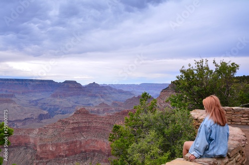 Woman looking out at the Grand Canyon.