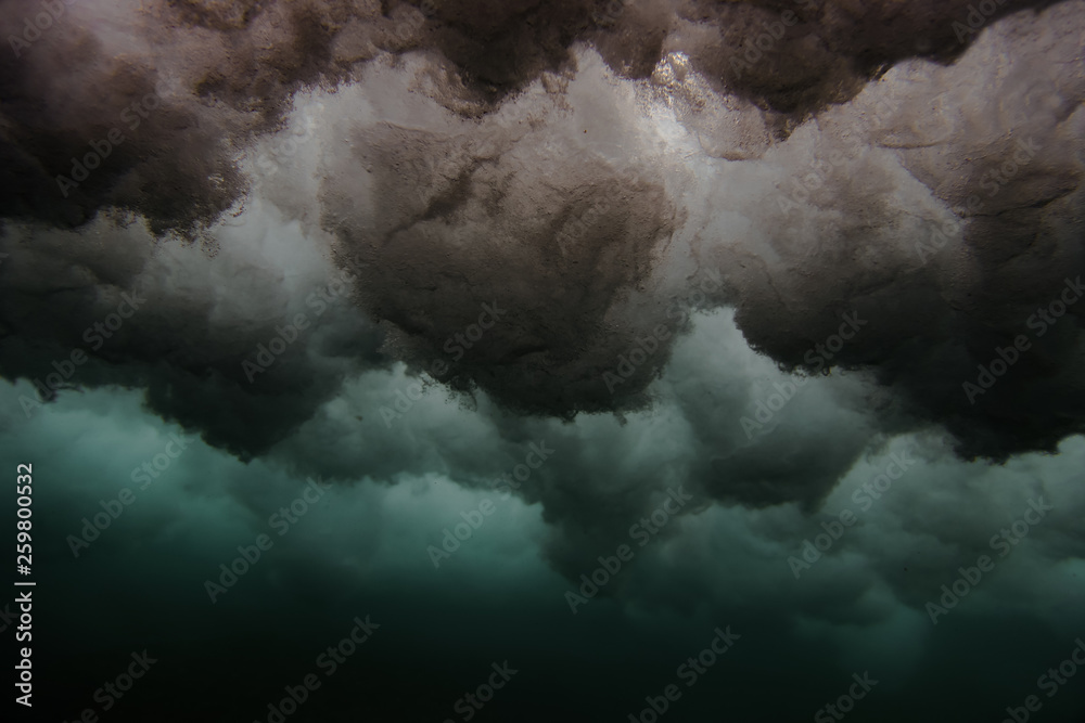 From below splashes in blue water of ocean on Bali, Indonesia From below splashes in blue water of ocean on Bali, Indonesia