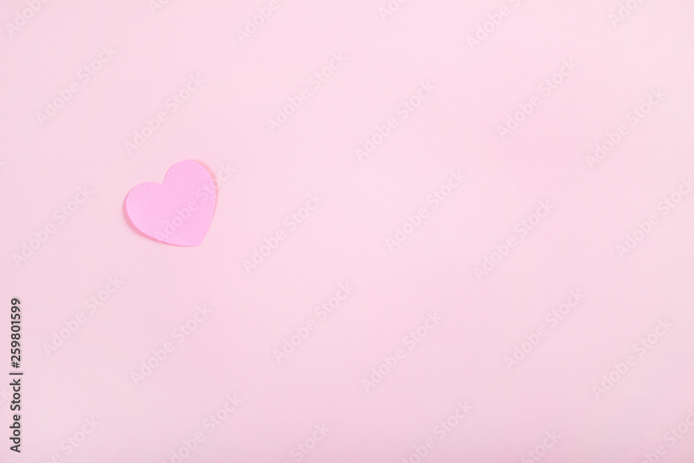 Pink heart shape on pink background