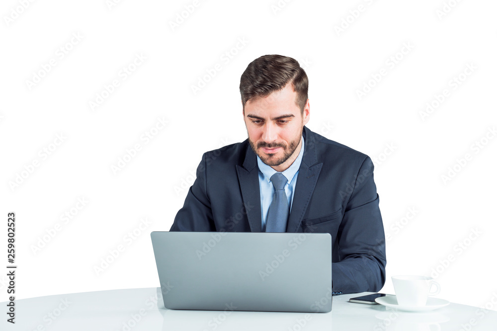 Serious man working at laptop, white background Serious man working at laptop, white background