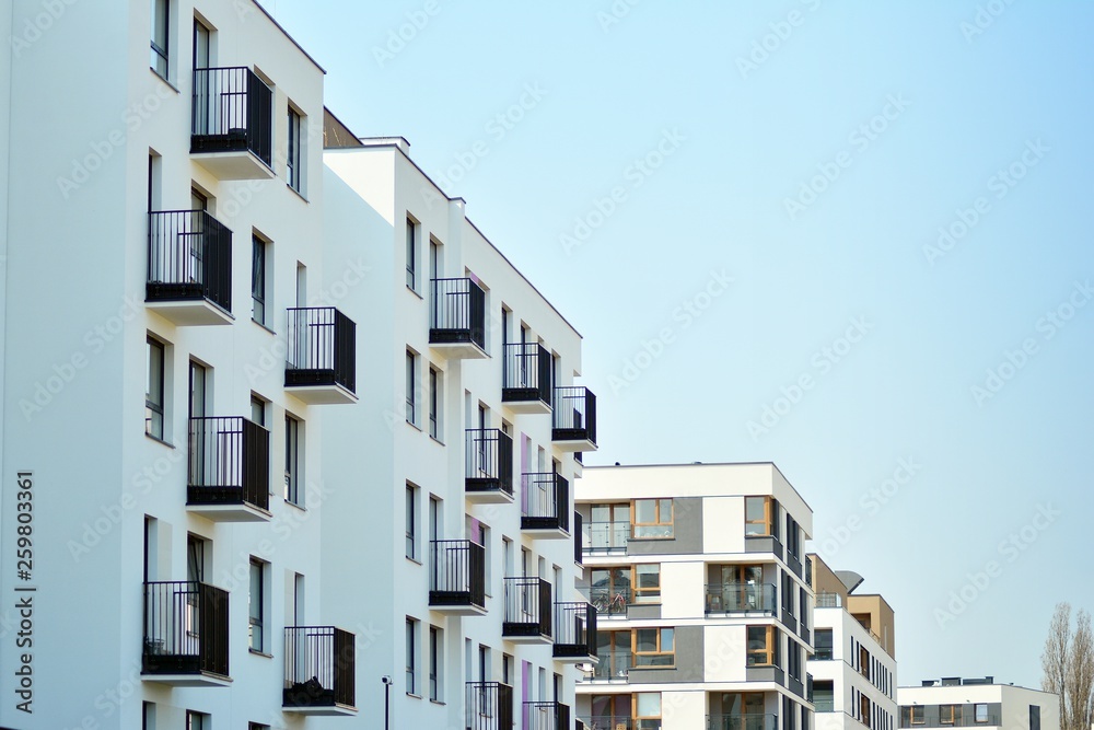 European modern residential architecture. Fragment of a modern apartment building in front. Very modern apartment house. European modern residential architecture. Fragment of a modern apartment building in front. Very modern apartment house.