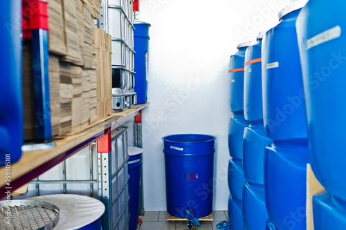 plastic barrel. Barrel on a pallet with a metal frame. Shipment of chemicals. Plastic container for liquids. photo