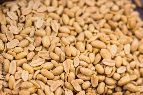 brushed peanut nuts food background on supermarket counter for selling 