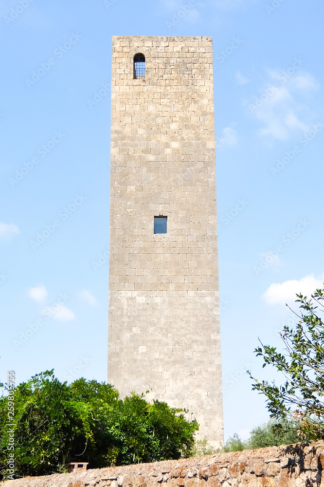 Tarquinia, Italy. Sunny day in Tarquinia. Beautiful view of catholic church (Chiesa di Santa Maria in Castello ). XI century. Tarquinia, Italy. Sunny day in Tarquinia. Beautiful view of catholic church (Chiesa di Santa Maria in Castello ). XI century.