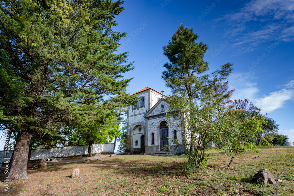 Church among trees at summer time, in figueiro dos vinhos, portugal. Church among trees at summer time, in figueiro dos vinhos, portugal.