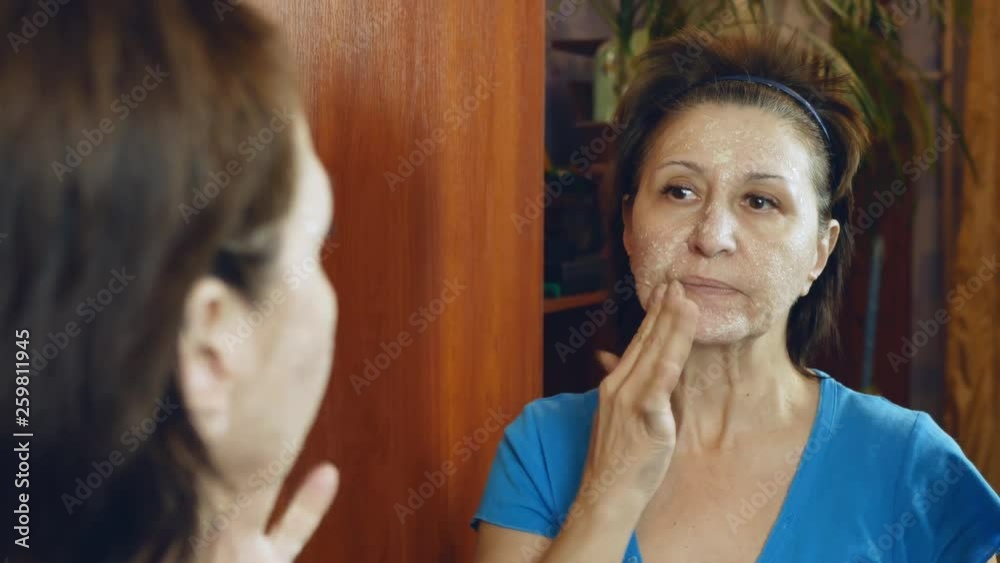 woman with problem skin does face massage with mask.Close-up woman with problem skin does face massage with mask.Close-up