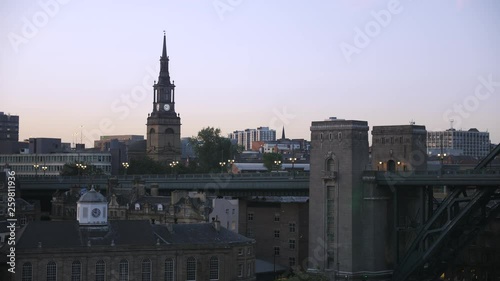 Newcastle city skyline, Tyne bridge and Church of Saint Willibrord with All Saints, Newcastle, England photo