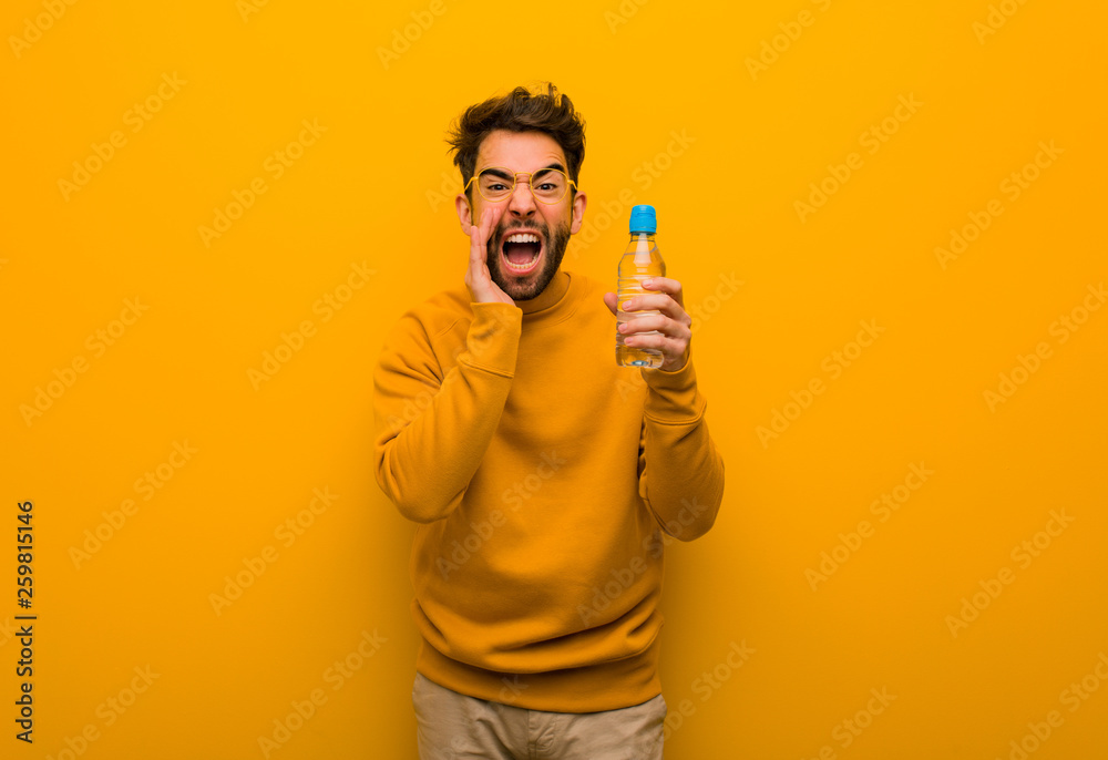 Young man shouting something happy to the front Young man shouting something happy to the front