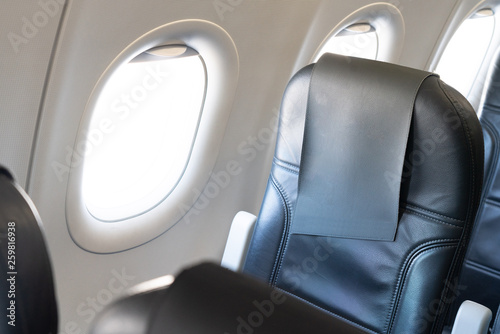 Airplane window seat with isolated white window inside the aircraft