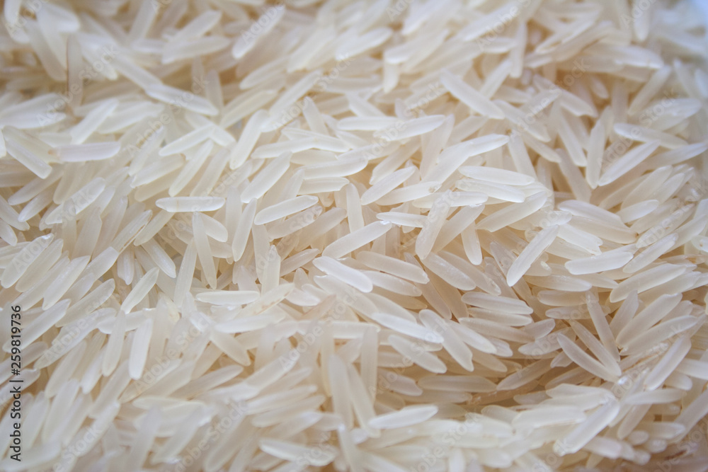 Raw basmati rice texture close up Raw basmati rice texture close up