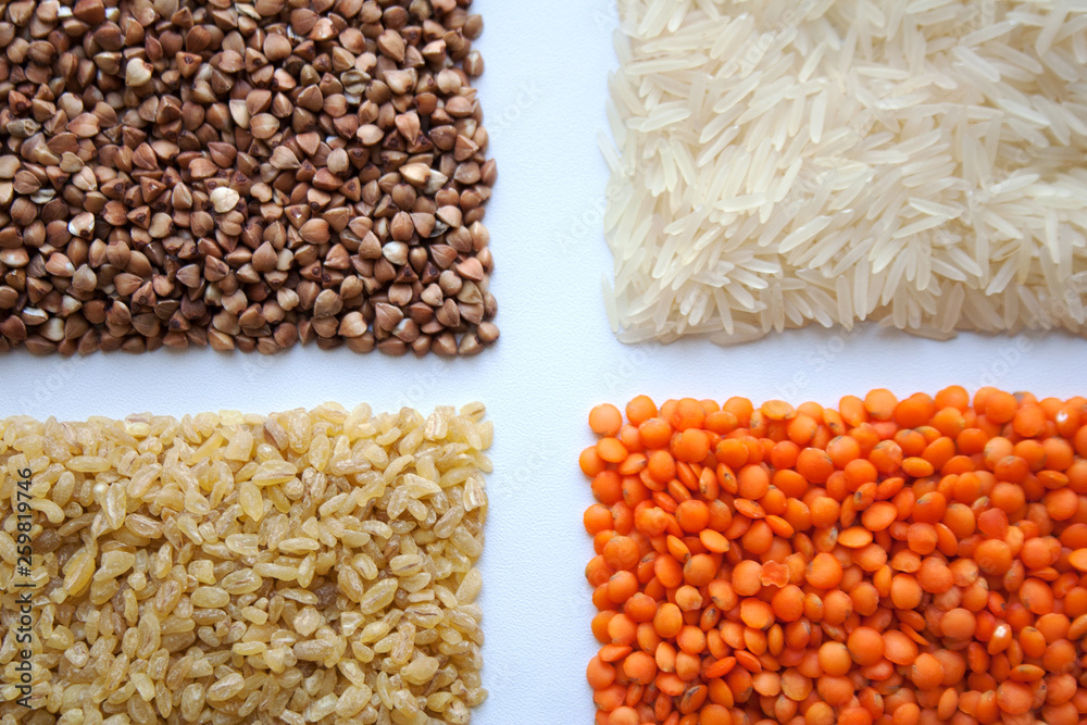 Raw buckwheat, basmati rice, bulgur and red lentils isolated on white background Raw buckwheat, basmati rice, bulgur and red lentils isolated on white background