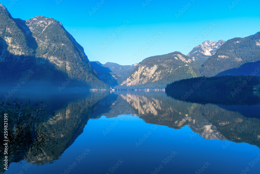 View of Mountain and its reflection in the lake  of Halstatt lake from Obertraun side in the morning, Upper Austria
