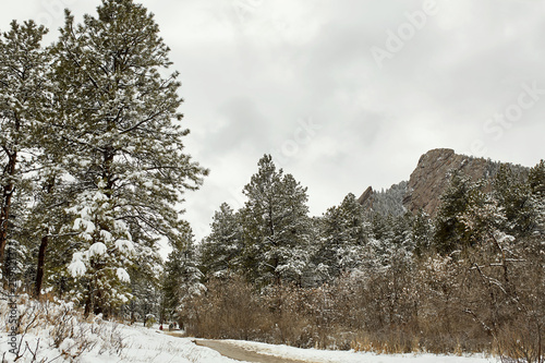 A Spring snow storm covers the mountain range, valley and Flatirons of Chautauqua Park, in Boulder, Colorado photo