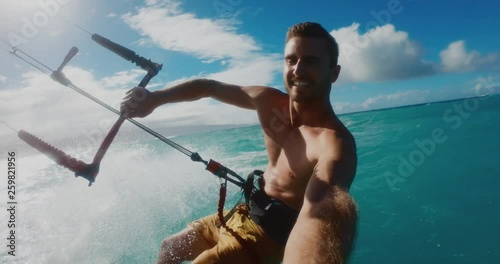 Kitesurfer riding with the wind