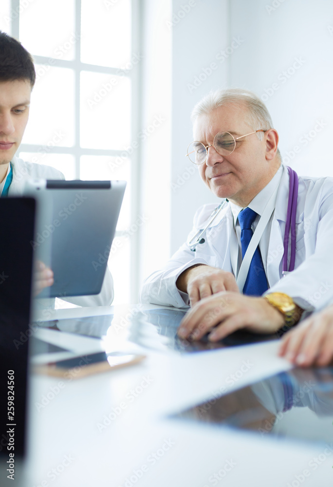Fototapeta premium Medical team sitting and discussing at table
