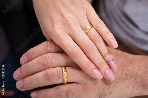 Couple's Hand Showing There Wedding Rings