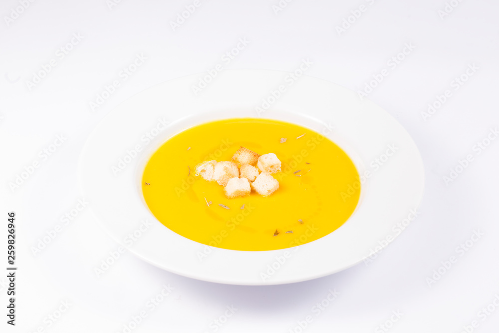 pumpkin cream dish with bread and oil on white background pumpkin cream dish with bread and oil on white background