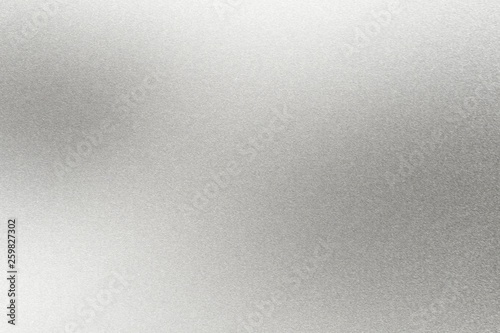 Abstract texture background, light shining on rough silver metal wall