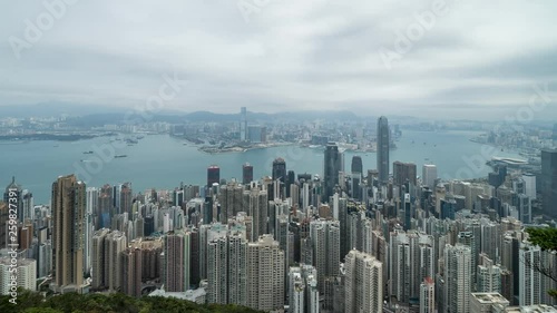 HONG KONG, CHINA - APRIL 2, 2019: 4K Cinematic Zooming In Time Lapse Footage of Victoria Harbour taken from The Peak in Hong Kong during cloudy day.