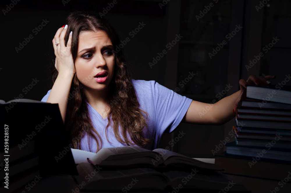 Young female student preparing for exams late at home Young female student preparing for exams late at home