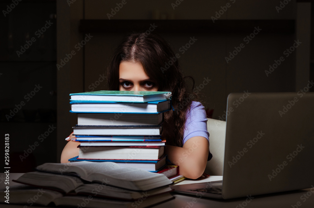 Young female student preparing for exams late at home Young female student preparing for exams late at home