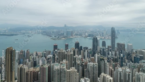 HONG KONG, CHINA - APRIL 2, 2019: 4K Cinematic Zooming Out Time Lapse Footage of Victoria Harbour taken from The Peak in Hong Kong during cloudy day.