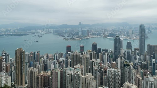 HONG KONG, CHINA - APRIL 2, 2019: 4K Cinematic Panning Left to Right Time Lapse Footage of Victoria Harbour taken from The Peak in Hong Kong during cloudy day.