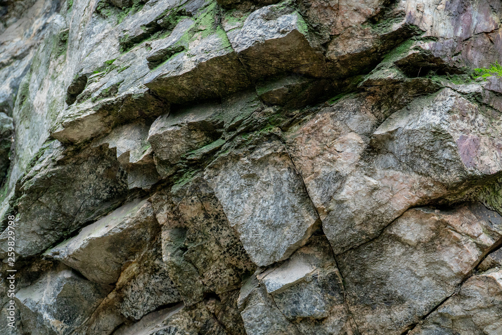 Detail of moss-covered rocks with sharp angles on mountain Detail of moss-covered rocks with sharp angles on mountain