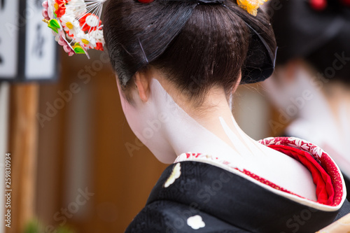 A traditional geisha out and about walking in Gion Kyoto Japan . Fototapet