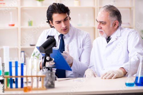 Two chemists working in the lab 