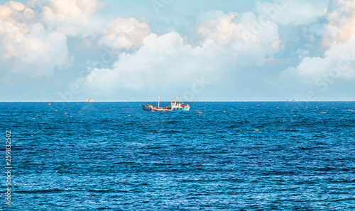 Fishing boat on water landscape © kvdkz