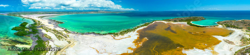Aerial view of Puerto Rico. Faro Los Morrillos de Cabo Rojo. Playa Sucia beach and Salt lakes in Punta Jaguey.  photo