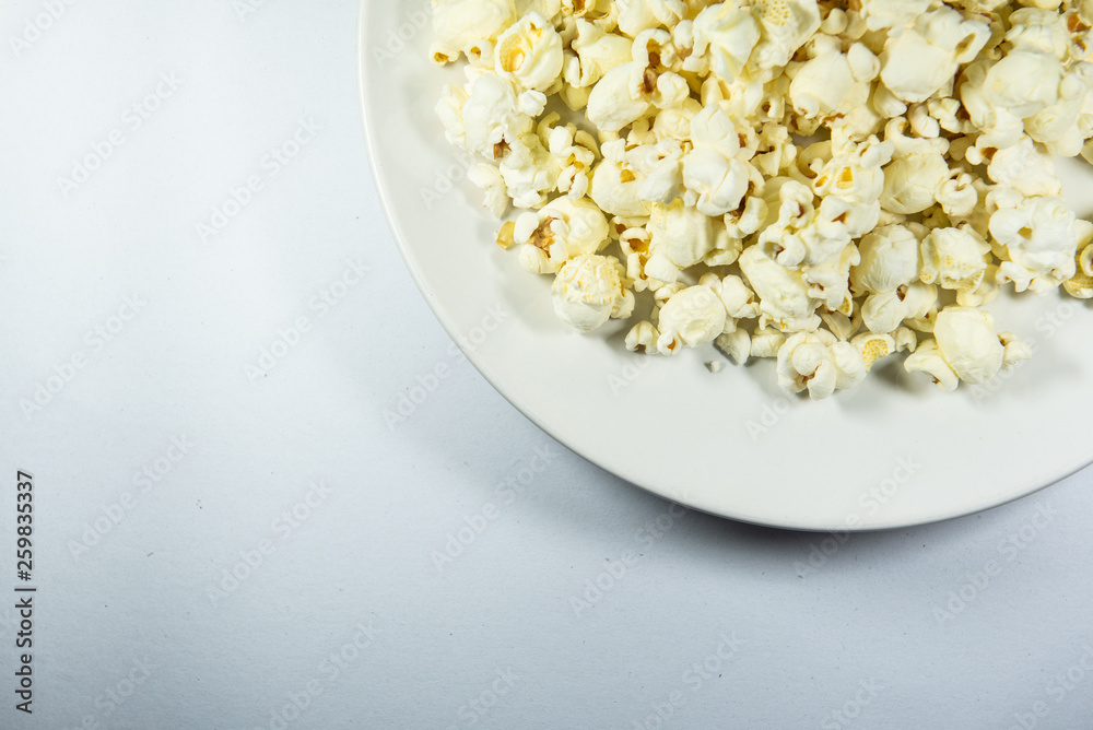 Popcorn in a plate on white background Popcorn in a plate on white background