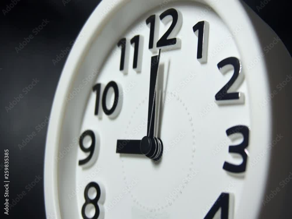 Clock ticking to 9:00 am or pm Clock ticking to 9:00 am or pm
