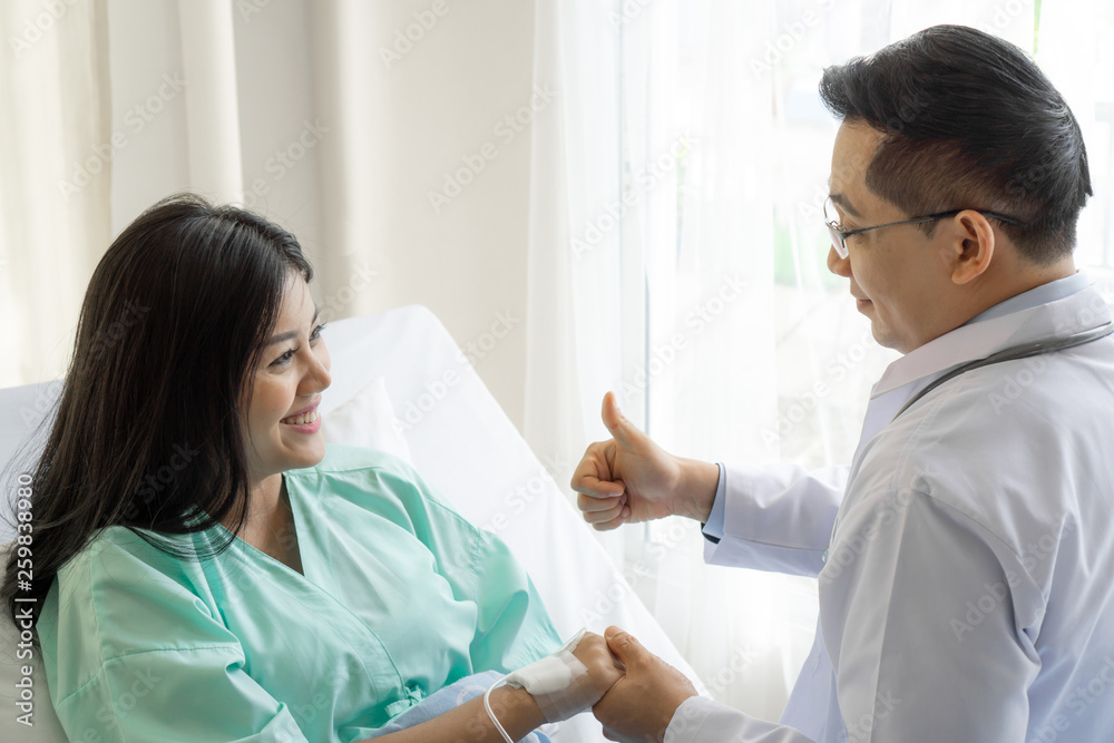 Doctors hold hands to encourage patients in the hospital- medical concept Doctors hold hands to encourage patients in the hospital- medical concept