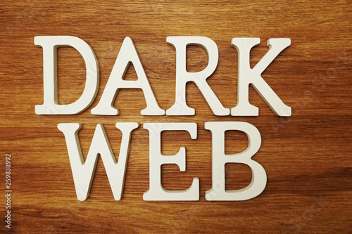 Dark Web word alphabet letters on wooden background