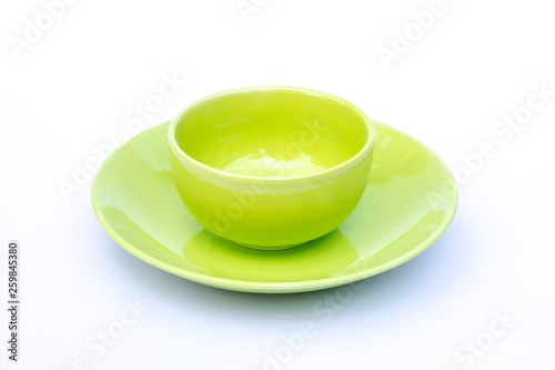 Fototapeta Naklejka Na Ścianę i Meble -  Empty green cup of coffee with plate isolated on white background.