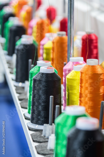 different color threads on the sewing machine