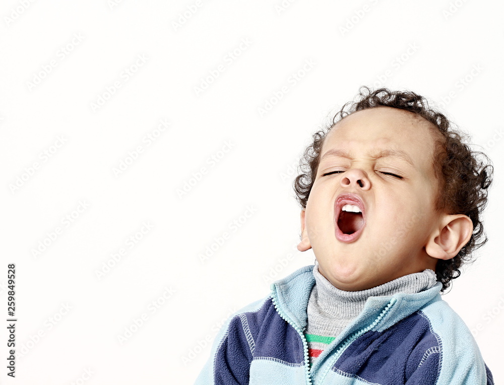 little boy yawning with textured background stock photo little boy yawning with textured background stock photo
