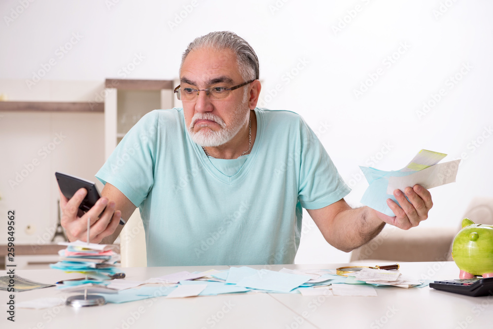 White bearded old man in budget planning concept White bearded old man in budget planning concept