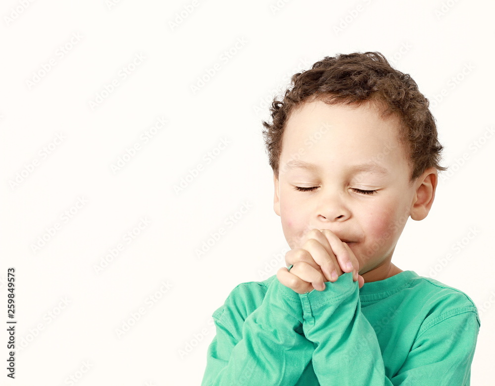 boy praying to God with hands held together stock photo boy praying to God with hands held together stock photo