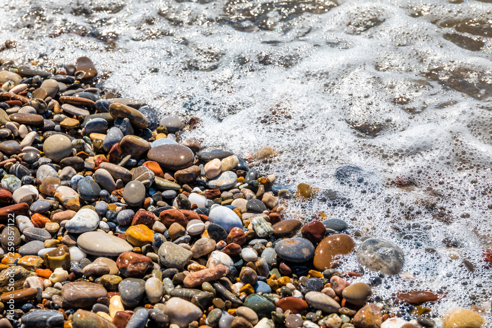 Beautiful pebbles on the beach close up