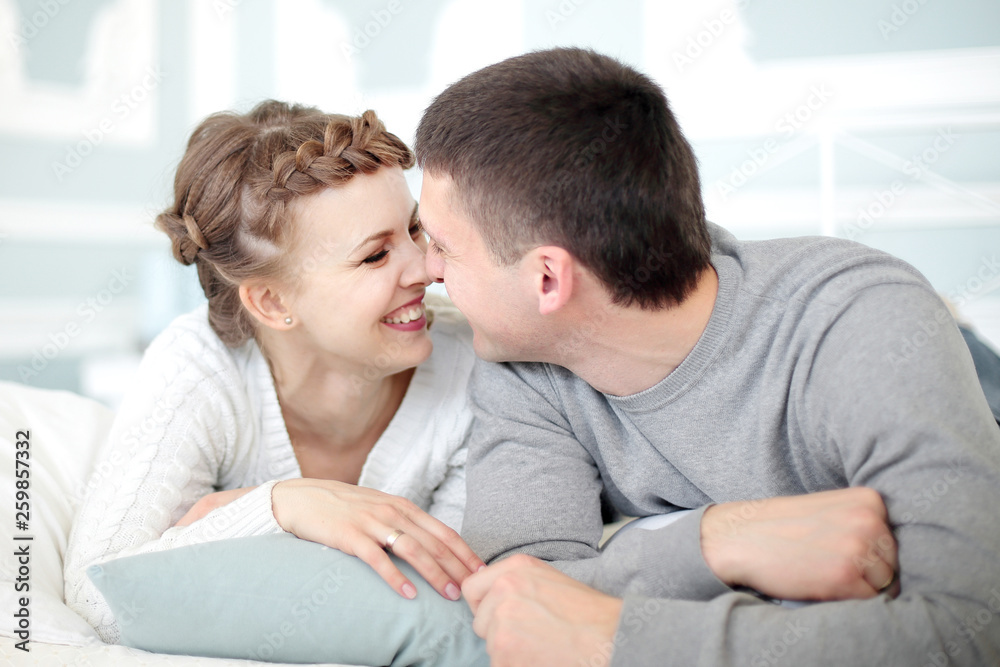 Young Smiling Romantic Couple relaxing in each others Company. Young Smiling Romantic Couple relaxing in each others Company.