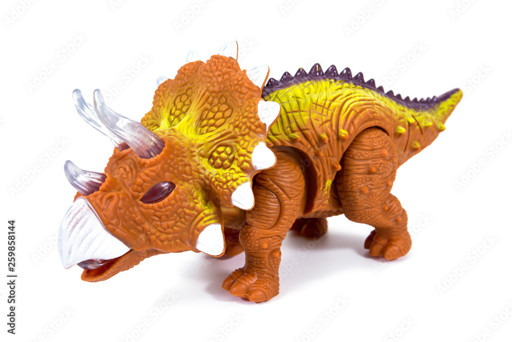Fototapeta premium Dinosaur toy isolated on white background. Triceratops dinosaurs toy isolated