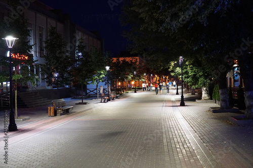 Dark alley and light trails in Hanover, Pennsylvania at night.