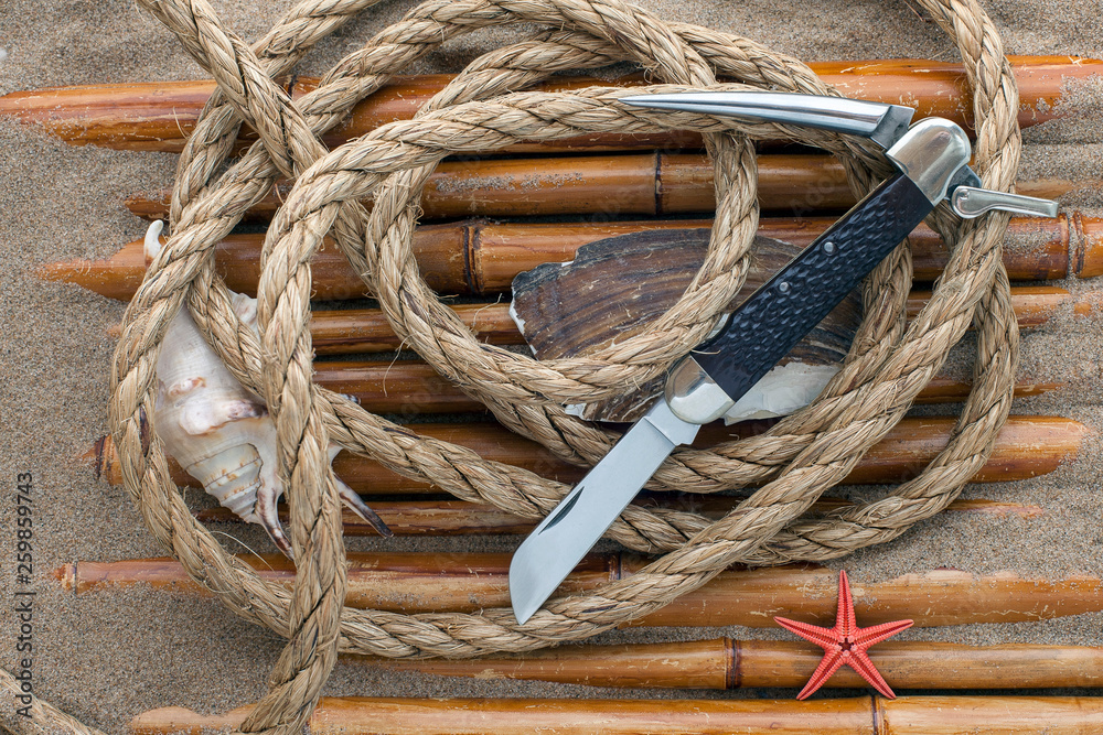 sailor knife, rope, shells and bamboo